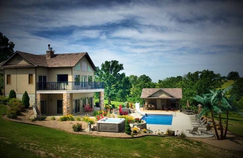 Belle House | Scenic Lakeside Chateau with Heated Pool, Hot Tub & Outdoor Kitchen-TV-Fireplace