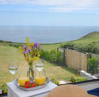 St. Levan House | SEA BREEZE - Stunning 6 Bedroom Eco Home with Sea Views