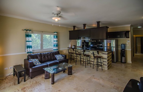 El Batey Apartment | Sea-views central condo with pool, BBQ. Guest-friendly, near sandy beach!