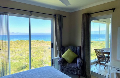 Hermanus City-Centre Apartment | Seafront @ Marine Terrace - views of Walker Bay. Whales, waves and sunrise