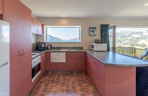 Wainui House | Seaview Outlook - Wainui Holiday Home