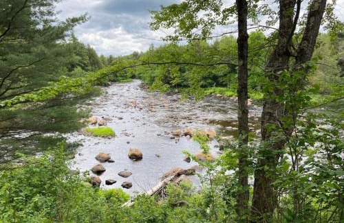 Hopkinton House | Secluded River Overlook Cabin on 160 acres.