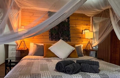 Marloth Park Cabin | See the Big 5 from the viewing deck of this incredible riverside bush lodge!