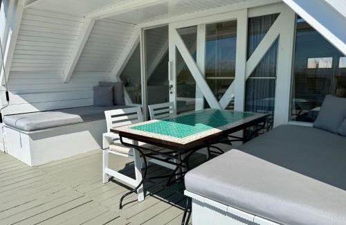 Rust Ski Chalet | Seehütte Neusiedlersee - Strandhaus, Elektroboot inklusive