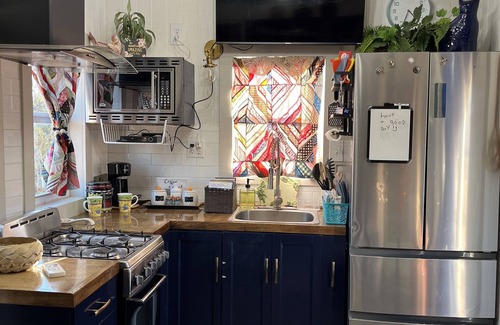 Sweetwater House | “SERENDIPITY” a boho inspired tiny home on wheels in country setting