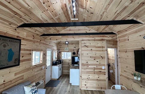 Frederic Cottage | Serene cottage on private lake! Enjoy a private dock, fire pit, canoe, & more!