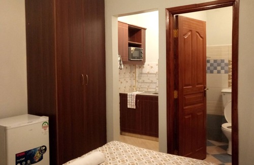 Gigiri House | Serene Green Guest Room