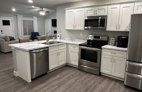 Quincy House | Serene & Modern Oasis - Newly Built, Attached Garage, Centrally Located