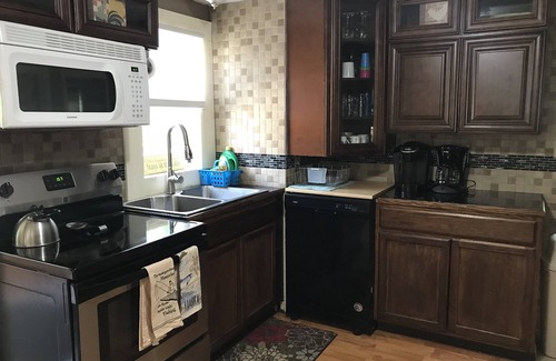 Wolcott Cottage | Serene Port Bay Cottage: waterfront, 3 kayaks, pedal boat, fire pit, grill, ac