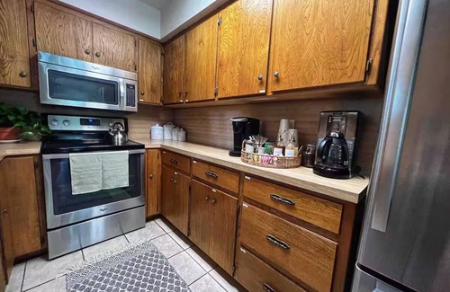 Burnet House | Shaded riverfront getaway. Dog friendly