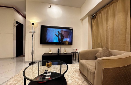 Goregaon West Apartment | Sky Oasis: Premium 2BHK I 65' TV, AC, High Floor, Andheri West