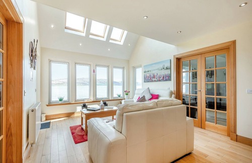 Innellan Cottage | Sky View is a detached new house for 6/8 enjoying spectacular sea views across to the Isle of Bute.