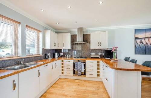 Innellan Cottage | Sky View is a detached new house for 6/8 enjoying spectacular sea views across to the Isle of Bute.