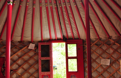 Indian Brook Resort | Small red yurt at Cabot Shores Wilderness Resort