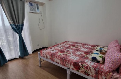 A. Bonifacio Apartment | Spacious 1 Bedroom Condo in QC with Best Skyline View