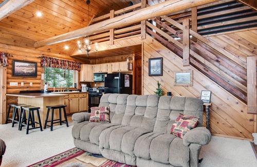 Presque Isle Cabin | Spacious and beautiful lakefront log home on 7 acres with private dock