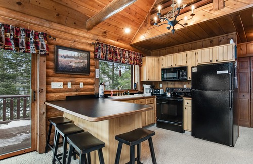 Presque Isle Cabin | Spacious and beautiful lakefront log home on 7 acres with private dock