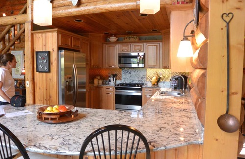 Treasure Lake House | Spacious Lakefront Log Home with large lakefront porch, firepit