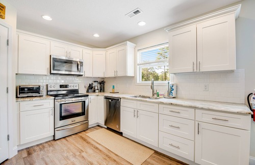 Maynardville House | Spacious, lakefront home with private dock, hot tub, chic decor, & amazing views