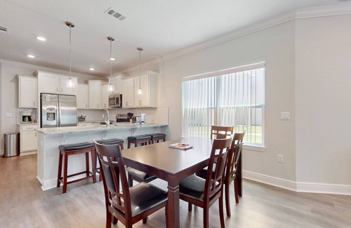 Navarre House | Spacious townhome, dog-friendly w full kitchen & shared pool