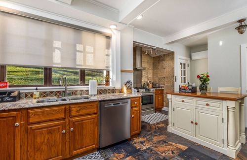 Dubuque House | Spanish Revival 1920 Home in Quiet Neighborhood