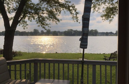 Coldwater Cottage | Spectacular sunset views and north chain lake front red cottage rental