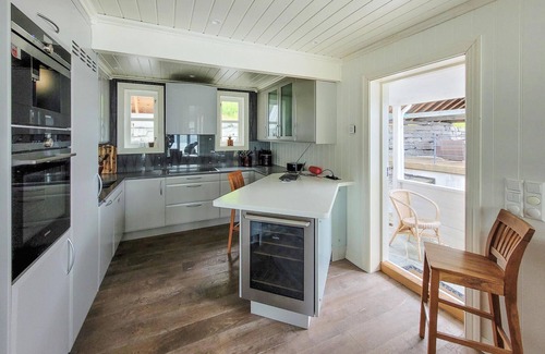 Oystese House | Spend an unforgettable vacation by the fjord in this comfortable vacation home.