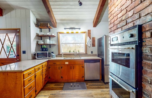 Centralia House | Sprawling and colorful lakefront home with patio