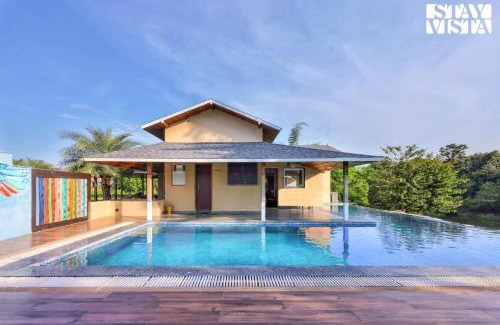 Jabalpur Villa | StayVista at Riverfront Cottage with Scenic River view, BBQ, Bonfire, Gazebo, Pet friendly