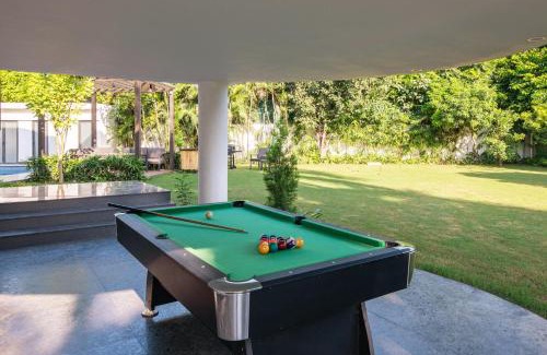Ludhiana Villa | StayVista's The Secret Lagoon with Outdoor Pool, Verdant Lawn & Indoor-Outdoor Activities