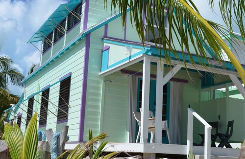 Spanish Wells House | Step from your porch onto the soft white sand & crystal clear water.