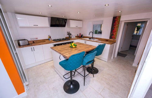 Port Talbot House | Step straight onto Afan Forest’s world-class bike trails from this two-bed, dog-friendly hideaway. Unwind by the crackling log burner after a day of adventure, stream movies on fast Wi-Fi or fire up the outdoor BBQ for dinner under the stars.<
