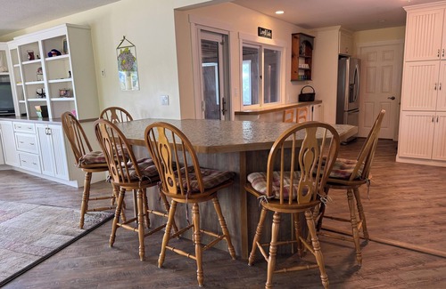 Sanbornville House | Stunning lakefront home with a boathouse, private dock, firepit and lake views
