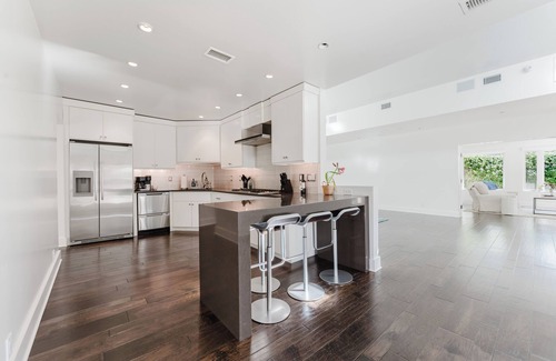 East Beach House | Stunning one-level, 5 bedroom East Beach home with heated pool & spa