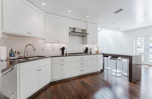 East Beach House | Stunning one-level, 5 bedroom East Beach home with heated pool & spa