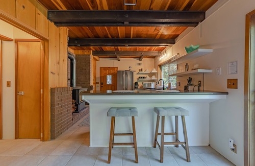 Salyer House | Stunning riverfront gem w/wraparound deck, beach access & game room