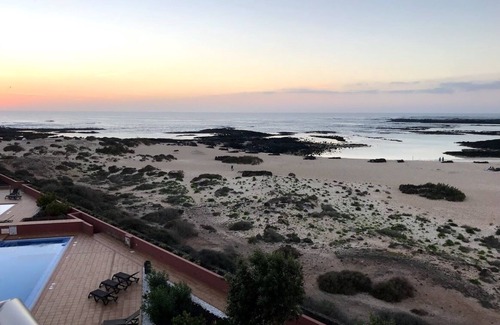 Los Lagos Apartment | Stunning views & location. Spacious 1 bed apartment directly on beach El Cotillo