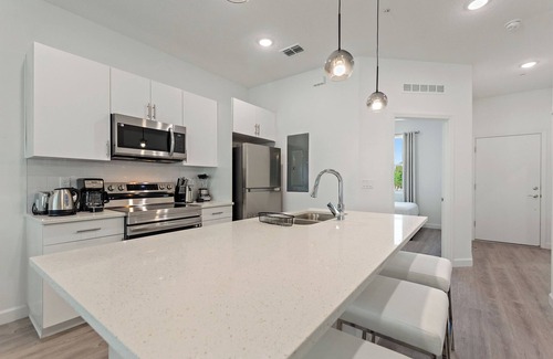 Loughman House | Stylish 3-Story Townhome with Private Hot Tub, Near Disney and Orlando Attractio