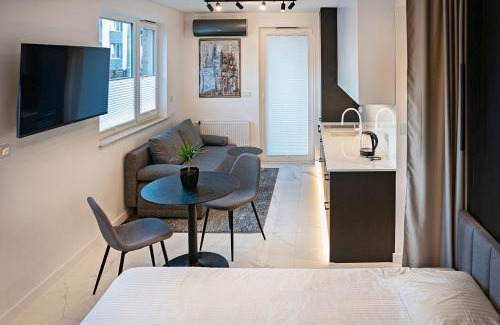 Wola Duchacka Apartment | Stylish Urban Retreat by UR4N!