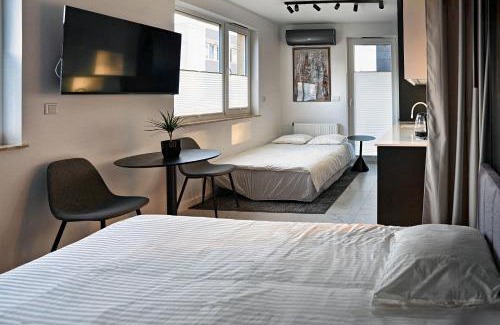 Wola Duchacka Apartment | Stylish Urban Retreat by UR4N!