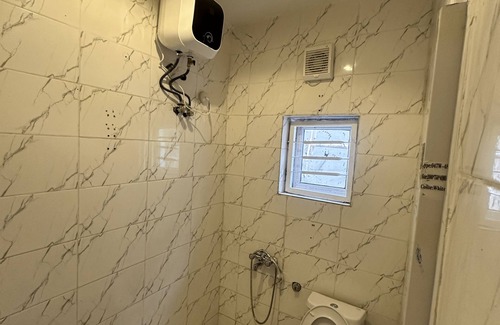 Abuja Apartment | Sunflower themed room in very serene and secure environment in the city center.