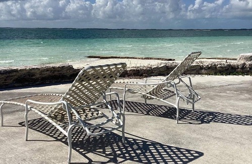 Treasure Cay Condo | Sunset condo with private deck and dock . Steps away from Windward beach.