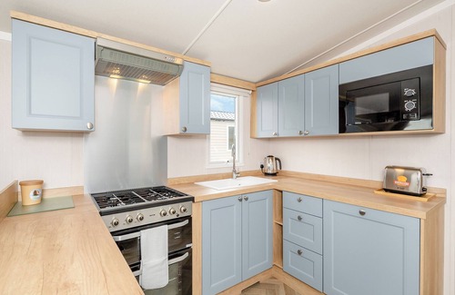 Otterton House | Super 12ft-wide luxurious caravan with one double and two twin.