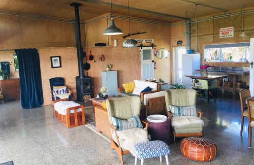 Taharoa House | Te Waitere Village spectacular water views of harbour and surrounding hillsides.