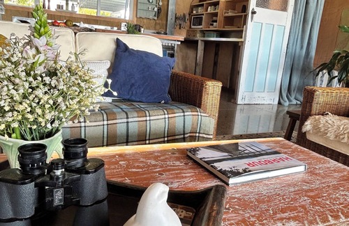 Taharoa House | Te Waitere Village spectacular water views of harbour and surrounding hillsides.