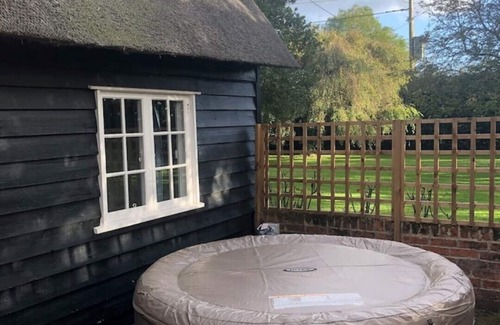 Manningtree Cottage | Thatched cottage, Wix with Hot Tub a secluded countryside location