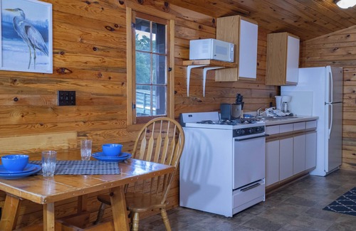 Walker Cabin | The Beach House Leech Lake - King bed &wall of windows just steps from the lake.