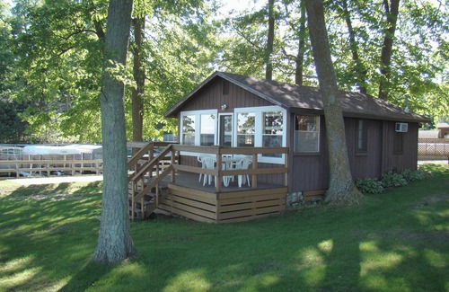 Walker Cabin | The Beach House Leech Lake - King bed &wall of windows just steps from the lake.