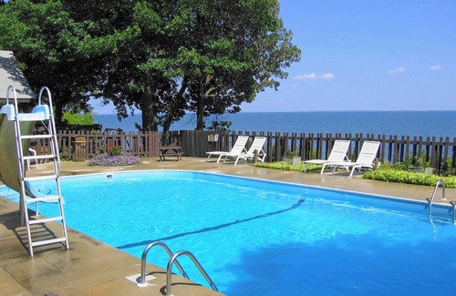 Walker Cabin | The Beach House Leech Lake - King bed &wall of windows just steps from the lake.