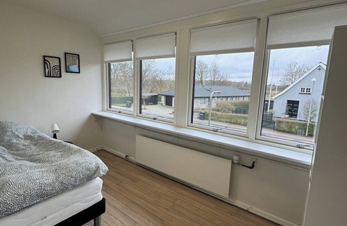 Odense Apartment | The Butterfly - Elegant Odense Retreat with Rooftop Views & Room for 7